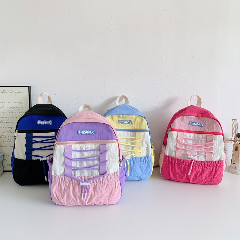 Mochila deportiva de ocio para niños y niñas, mochila de estudiantes de escuela primaria de gran capacidad de aire extranjero 2025 mochila infantil de cuerda de color contrastante