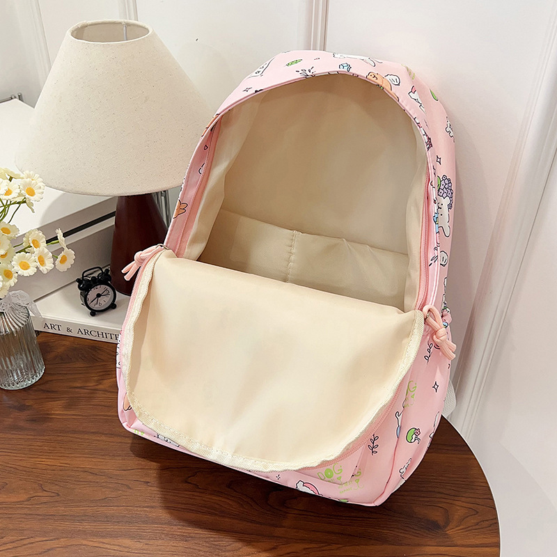Nueva pequeña mochila fresca encantadora niña de secundaria secundaria estudiantes de mochila ligera de viaje mochila de gran capacidad