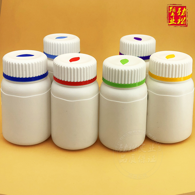 Botellas de hojas de anuncios, tabletas de calcio coloridas, tabletas masticables, botellas de salud blancas, embalaje médico, botellas de plástico HDPE, botellas de medicamentos en stock image 1