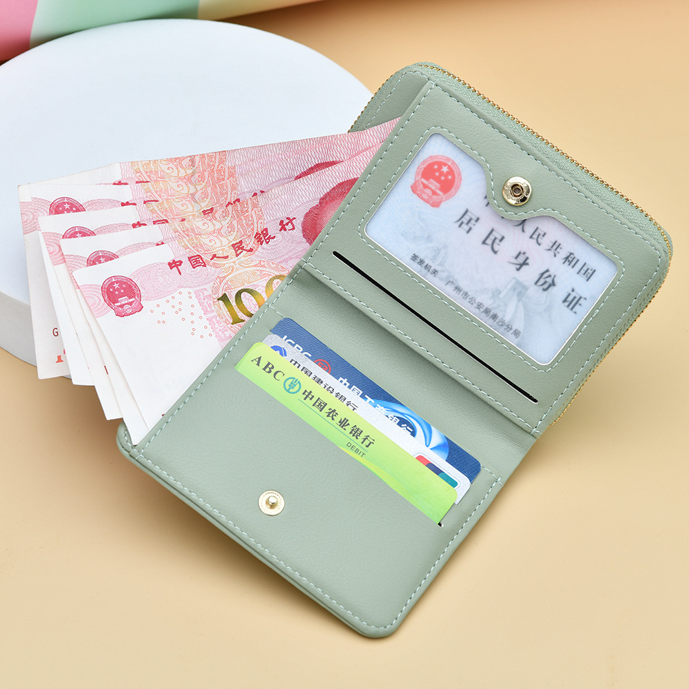 Cartera transfronteriza para mujeres nueva y fresca bolsa de tarjetas con cremallera PU pequeña bolsa de cambio plegable corta de dama alta sensación de cartera