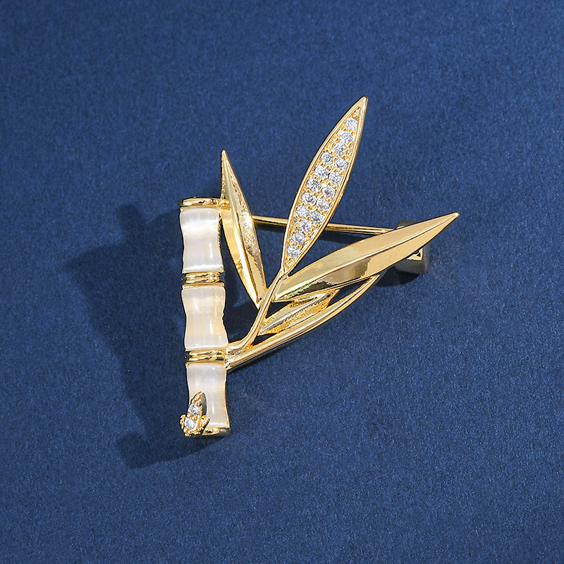 Oro verdadero, piedra de ojo de gato, piedra de bambú, pin de diseño, fiesta de flores de pecho, accesorios de broche anti-luz