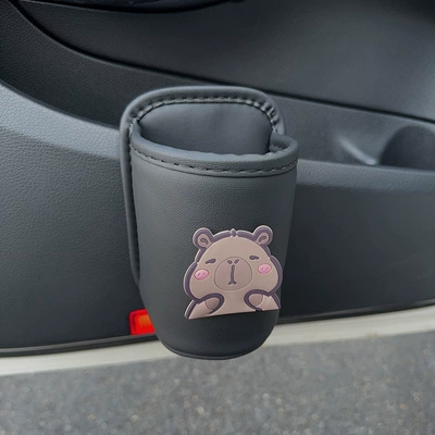 Cute electric vehicle cup holder, Car cup holder/beverage holder - black-cup-holder-squinting-capybara