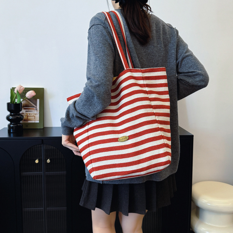 Bolsas de lona a rayas de doble cara nicho de mujeres coreanas de gran capacidad perezosa bolsas de compras de ocio de estudiantes