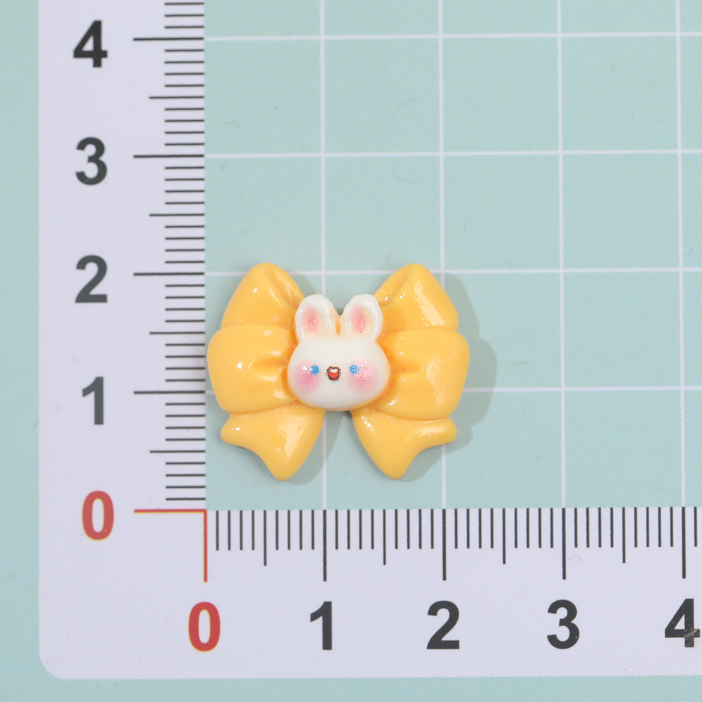 Dibujos animados macaron mariposa conejo resina accesorios DIY crema pegamento horquilla accesorios para el cabello teléfono móvil Shell material hecho a mano al por mayor