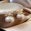 Advanced earrings from pearl with bow, demi-season silver needle, french style, high-quality style, light luxury style