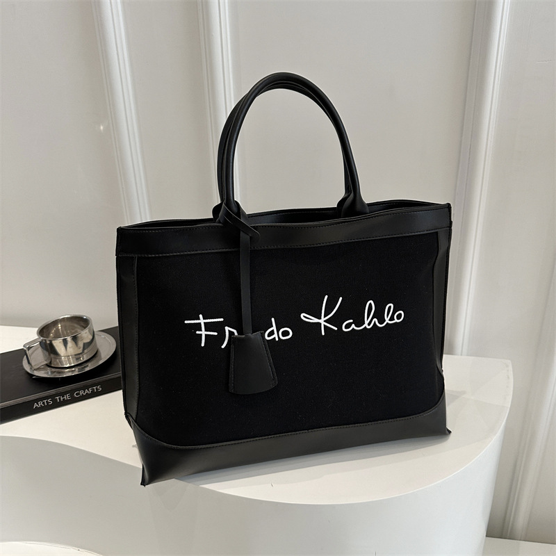 Casual retro alta sensación de bolsas portátiles de gran capacidad para mujeres 2025 nueva moda de color de viaje bolsas de mano