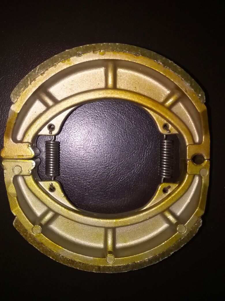 Original suministro directo accesorios motocicleta freno eléctrico bloque AX100 calidad estable experiencia 28 años