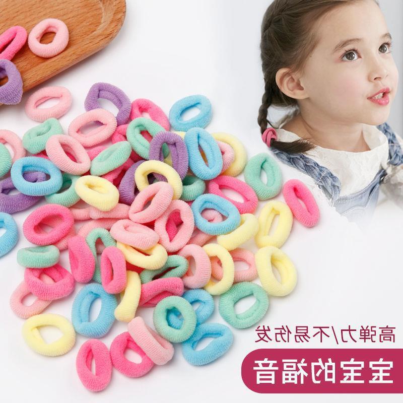 Banda de goma de bebé Corea del Sur banda de pelo de los niños anillo de toalla de color caramelo bolsa de Margarita banda de pelo OPP bolsa cuerda de pelo banda de goma al por mayor