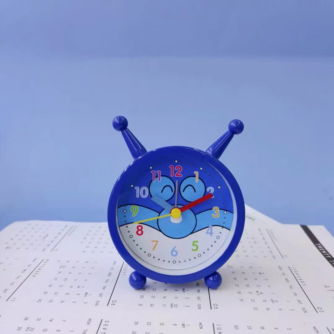 Reloj de alarma creativo directo de fábrica decoración de mesa de noche reloj de alarma para estudiantes y niños Reloj portátil al por mayor