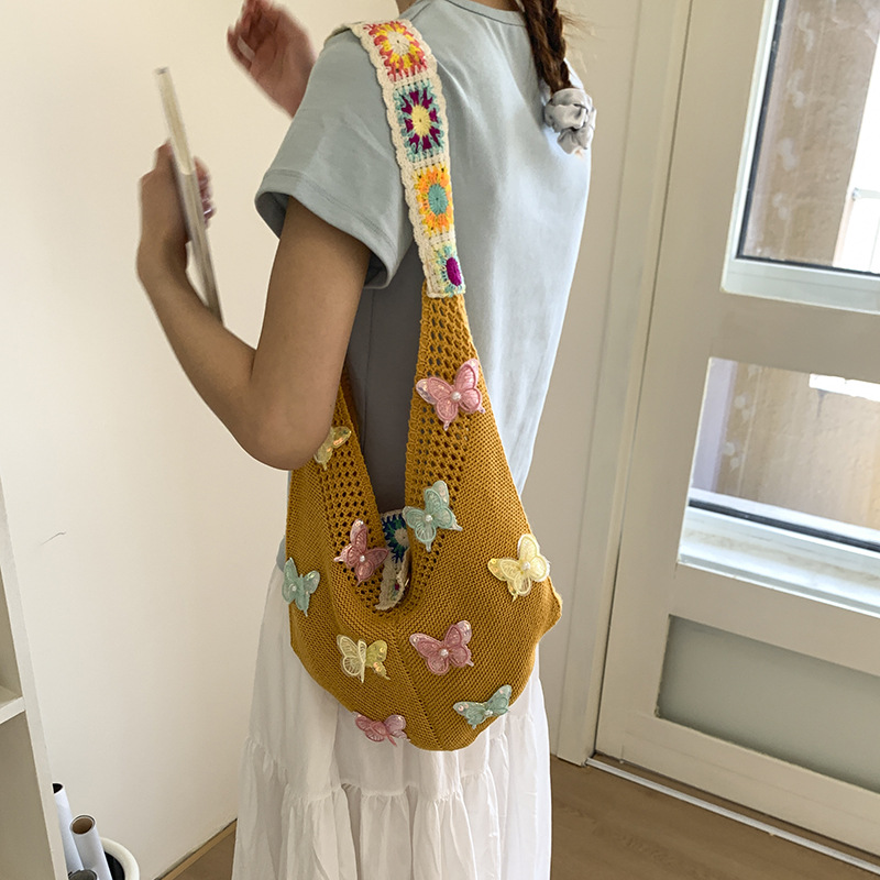 Versión coreana del bolso de nicho 2025 verano nuevo bolso femenino mariposa bolso tejido bolso de hombro de punto de gran capacidad