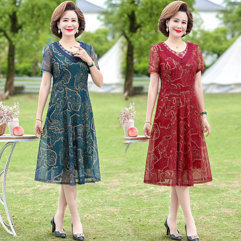 中年のお母さんの婦人服の半袖のワンピースの夏服の洋風の百塔の気質の大きいサイズの新型はやせている中高年のスカートを現します。|undefined