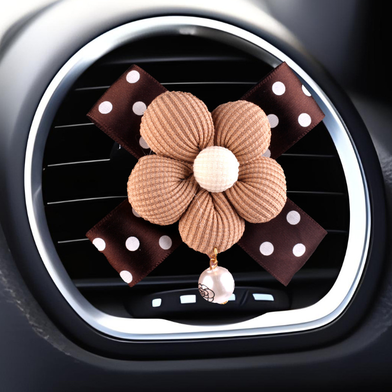 Nueva decoración de coche de aromaterapia de camelia creativa, decoración de salida de aire acondicionado de la consola central del coche de fragancia pequeña