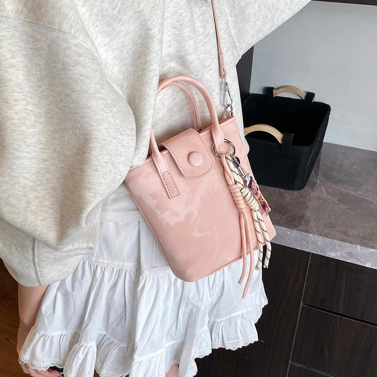 Verano super caliente mini bolso de mano para mujeres 2025 nueva moda bolso de balde de moda explosión de textura universal mochila