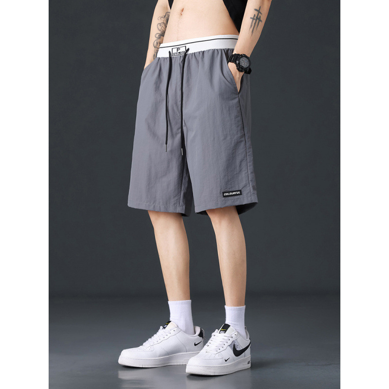 Pantalones cortos de hielo para hombres de verano negro delgado deportivo de hombre de verano rápido secado pantalones de baloncesto de playa de cinco puntos