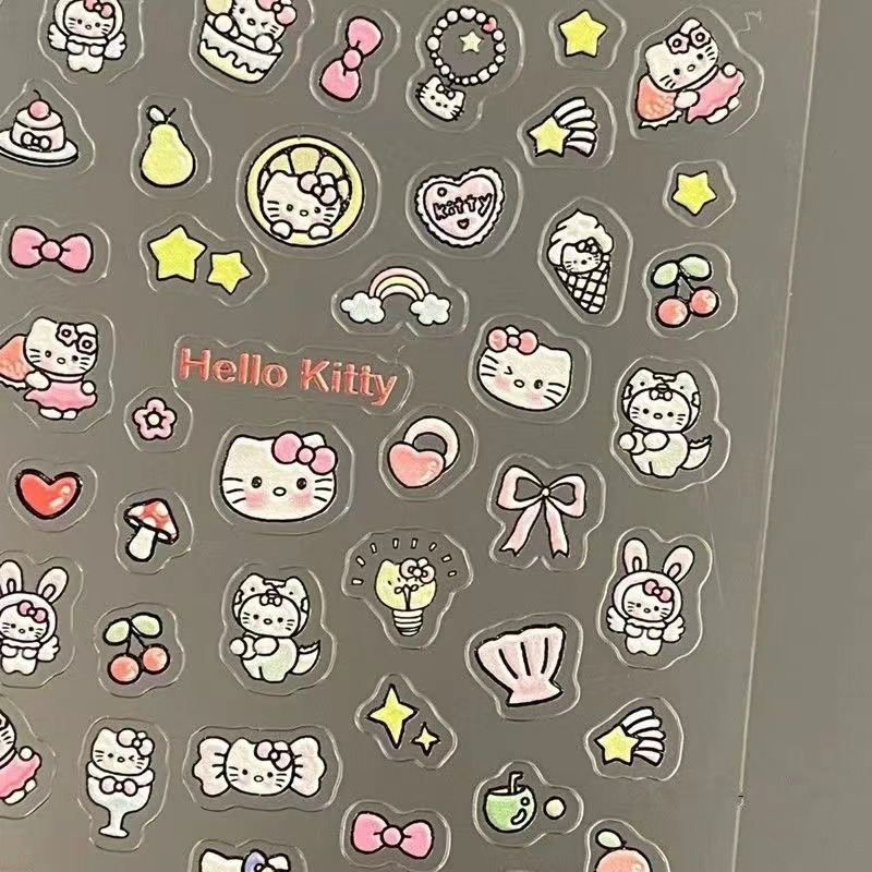 赤い本と同じ高颜値のケイティの携帯電話はかわいいハローキティの猫のネイルシールの爪を貼って絵を貼ります。|undefined