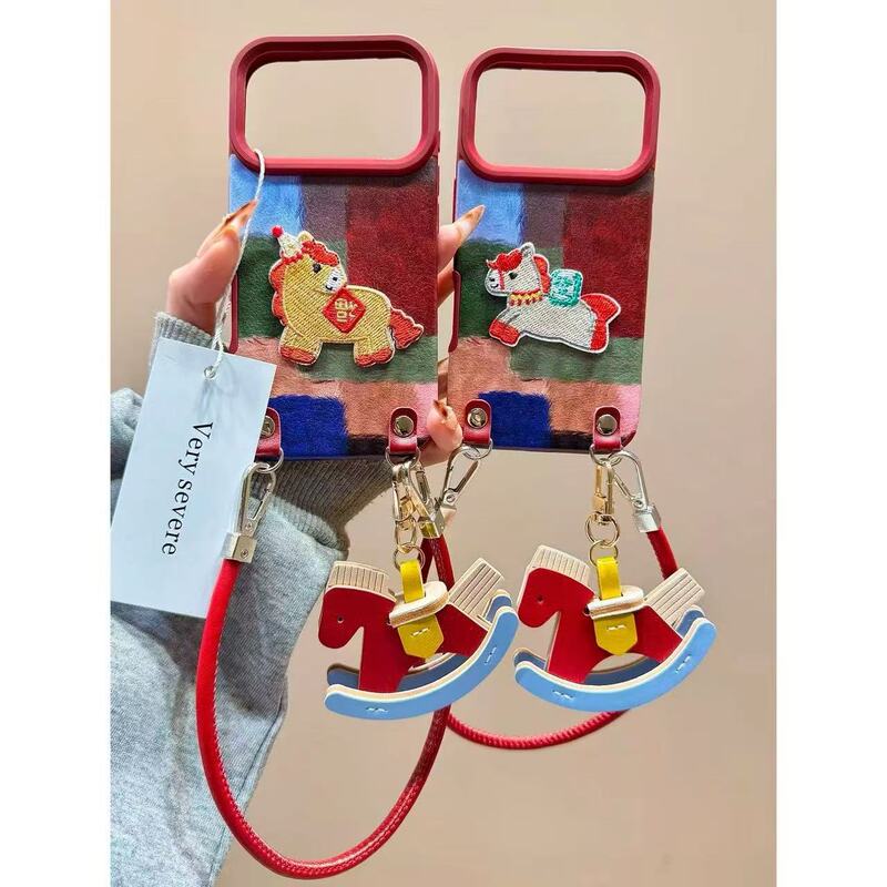 Leather Texture Color Block Embroidery Lucky Horse Pendant Hand Strap Suitable for iPhone 17 Pro Max Apple 16 Phone Case 15 Leather Texture Color Block Embroidery Lucky Horse Pendant Hand Strap Suitable for iPhone 17 Pro Max Apple 16 Phone Case 15