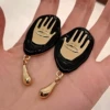 Black earrings * gold drop-shaped