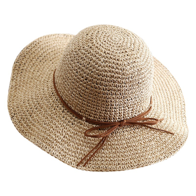 新型の帽子の女性の夏の砂浜の日よけの帽子の草は編んで、日焼け止めの日よけの帽子の大きい縁の折り畳みの麦わら帽子のメーカーの卸売りに乗ります。