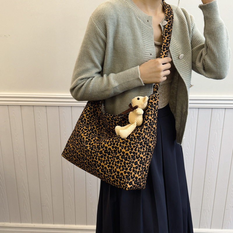 Estudiantes universitarios clase de viaje bolsa de gran capacidad para mujeres 2024 nueva moda extranjera leopardo tela mochila