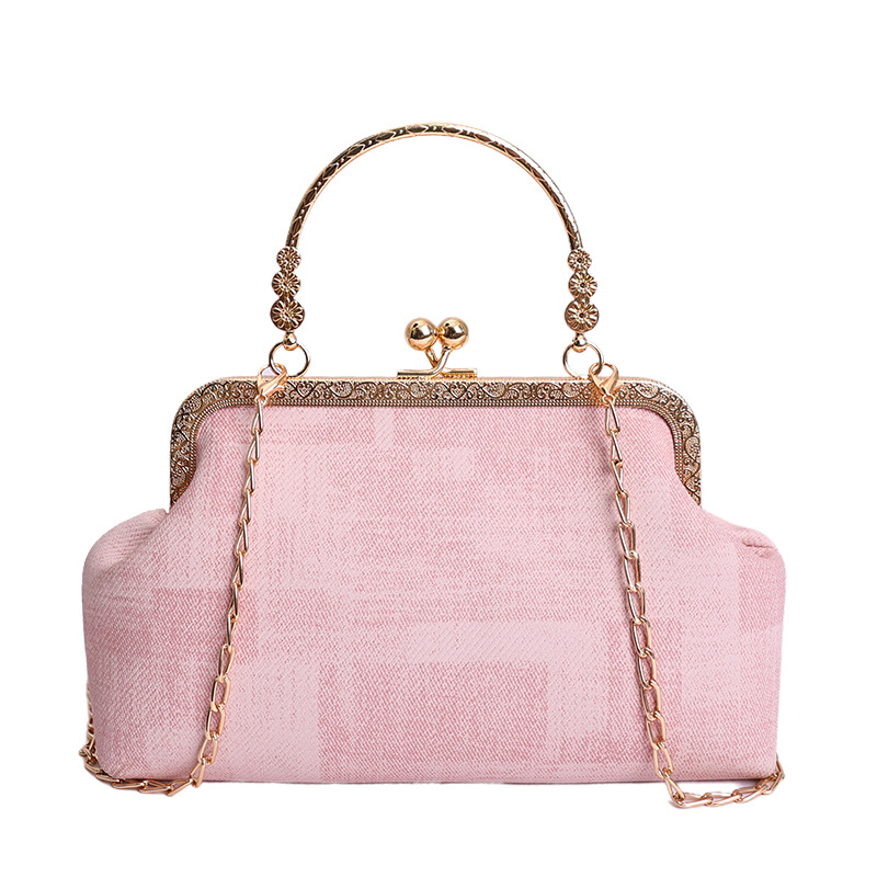 2026 nuevo pequeño viento de cadena bolsa de cena de mujeres de alto nivel sensación abrazadera bolso de mano mochila de estilo de moda bolsa de conchas