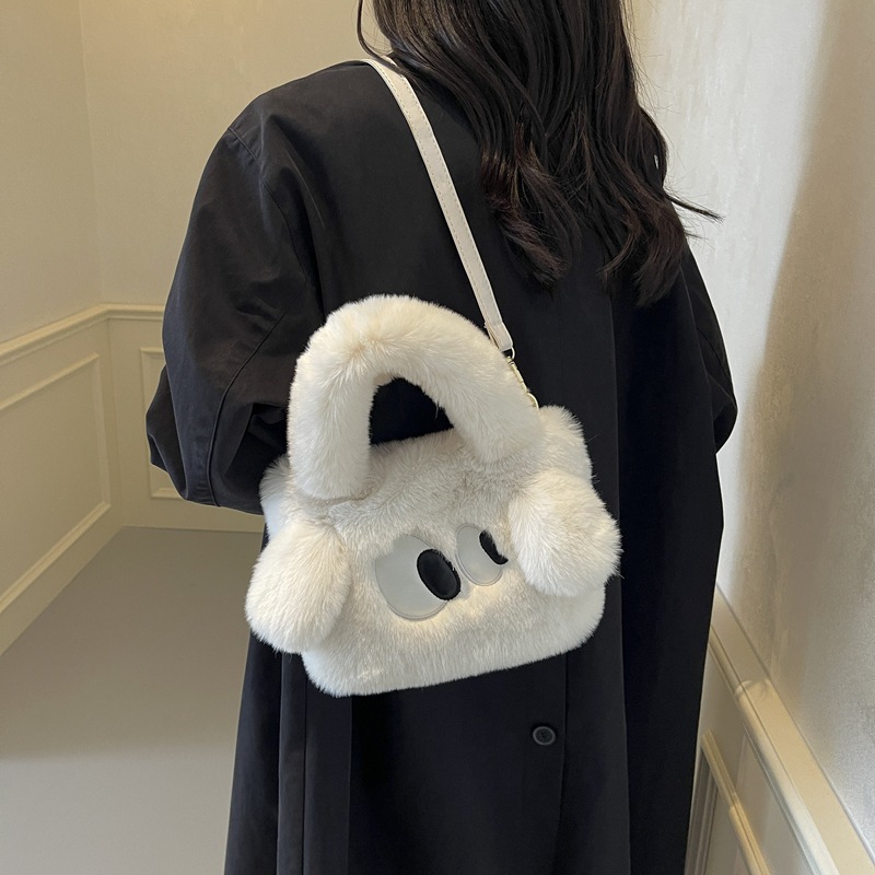 Bolsa de cubo de pelúcia de ojos grandes perros mujeres otoño y invierno 2025 nuevo tipo de bolso de hombro, bolso de mochila encantador