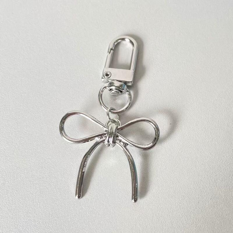 Korean Style Silver Alloy Bow Bag Mobile Phone Pendant Fashionable Work Clothing Stylish Simple Girl Key Pendant Korean Style Silver Alloy Bow Bag Mobile Phone Pendant Fashionable Work Clothing Stylish Simple Girl Key Pendant