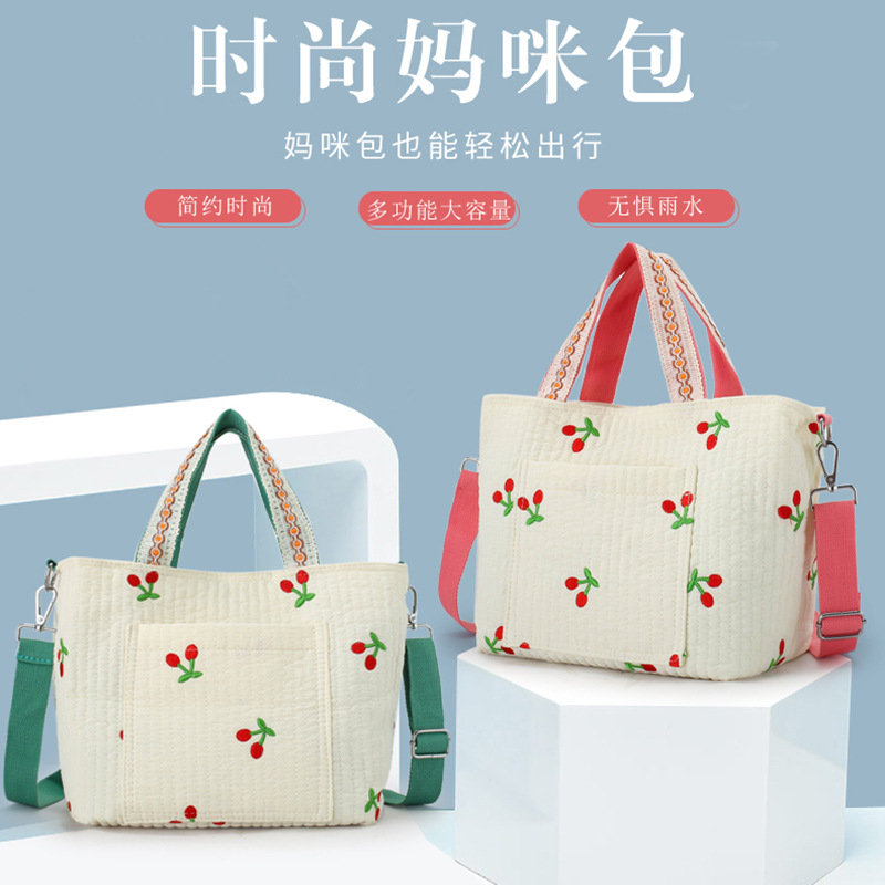 Wholesale mommy bag, fashionable and beautifully embroidered nylon mother and baby bag, outdoor lightweight waterproof portable cross-body mommy bag for women