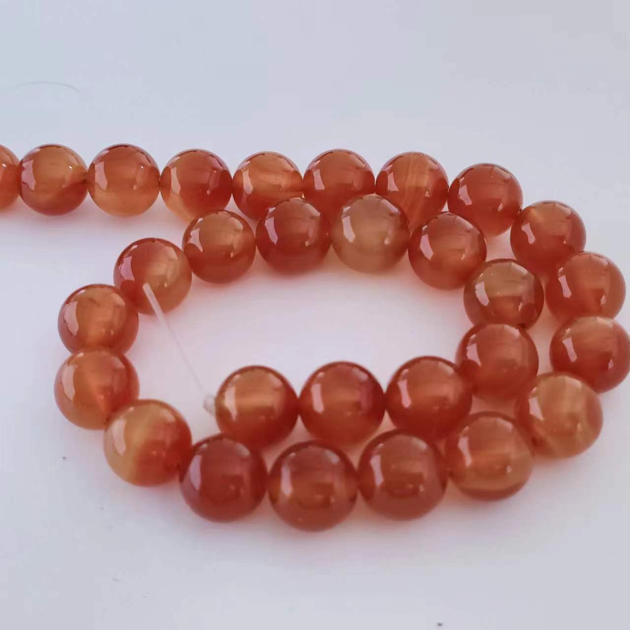Precio de fábrica de 7A perlas de Buda naturales ágata rojo a granel diy accesorios de joyería perlas de ágata negro perlas semiacabadas