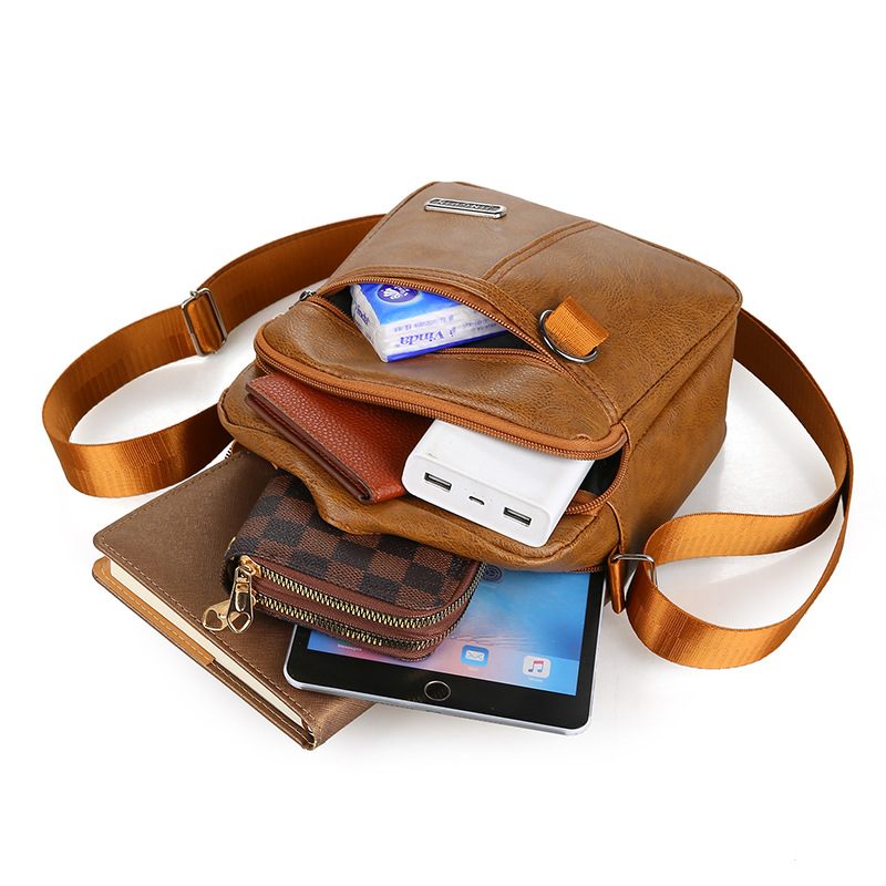 Bolso de los hombres bolso de mensajero ocasional del hombro del negocio partido de la moda vertical japonés y coreano nuevo bolso de los hombres mochila pequeña fábrica al por mayor