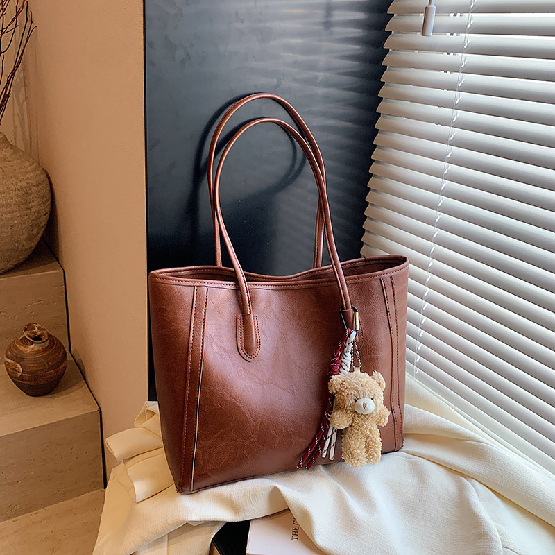 Bagos de textura de transporte aéreo 2024 otoño y invierno nuevo estilo coreano de moda bolso de hombro axilar temperamento bolso especial