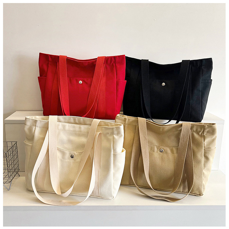 Wholesale of new women's single-shoulder bags, cross-border simple and casual canvas bags, Korean version LOGO printed commuter tote bags undefined