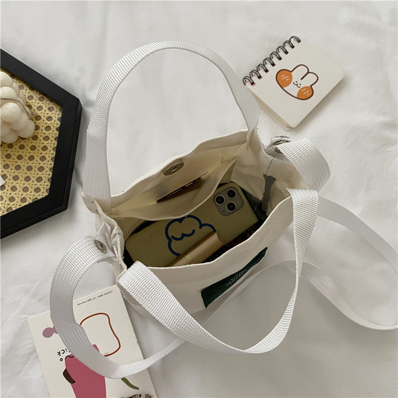 Bolso de mujer nuevo estilo coreano simple bolso de lienzo de chicas fresco de color sólido bolso de cubo de moda moda bolsa de mochila casual