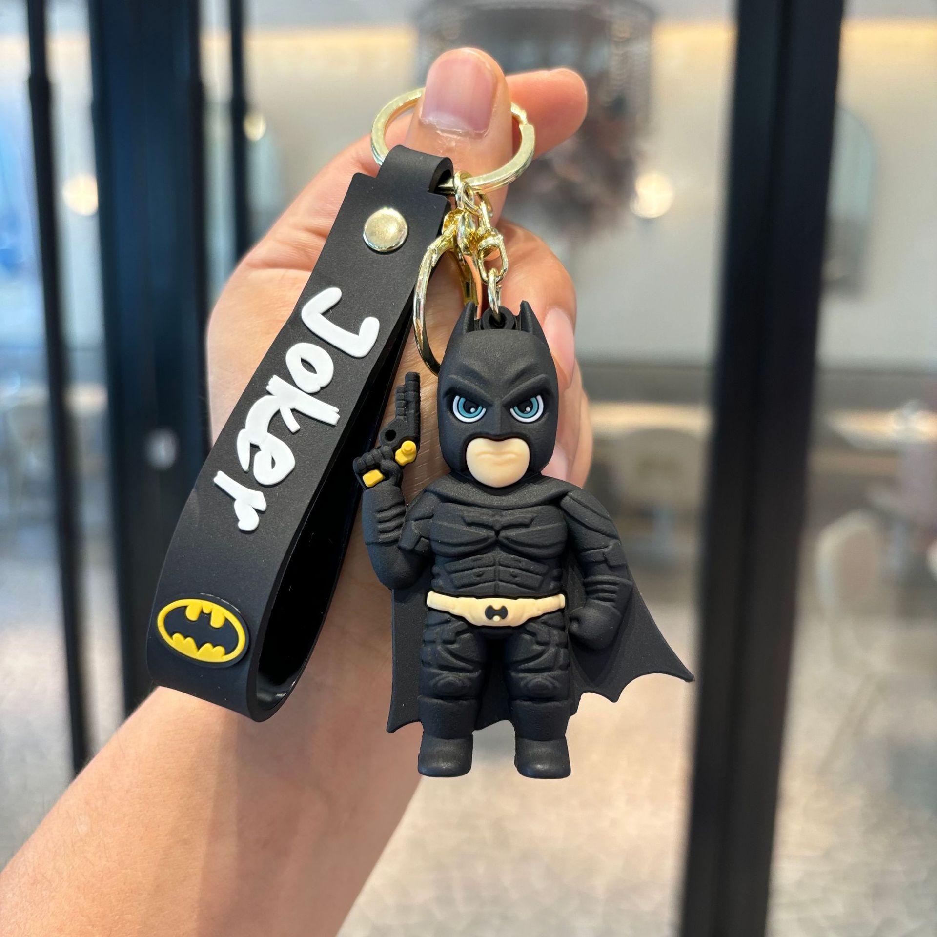 Batman cruzado superhéroes clown muñeca coche llavero colgante muñeca máquina de regalo pequeño