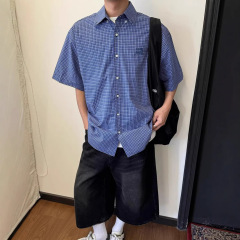 アメリカのレトロで怠惰な高級感の青い格子の半袖のシャツの男女のゆったりしている百合のカジュアルな刺繍のシャツの潮