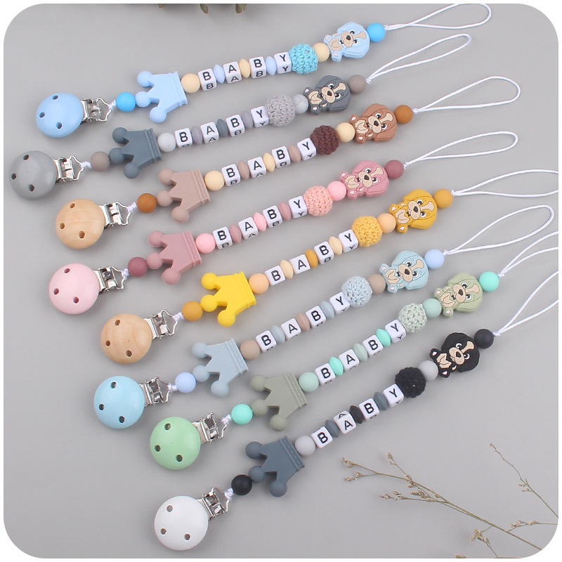 Suministros de bebé de silicona chupete Cadena de dibujos animados animal perro mordedura de silicona molar Cadena de juguete Nuevo