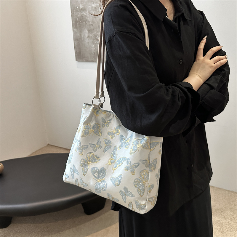 Nueva bolsa de gran capacidad de estilo chino para mujeres 2024 nueva moda bordada bolsa de hombro para trabajar bolsa de viaje moda