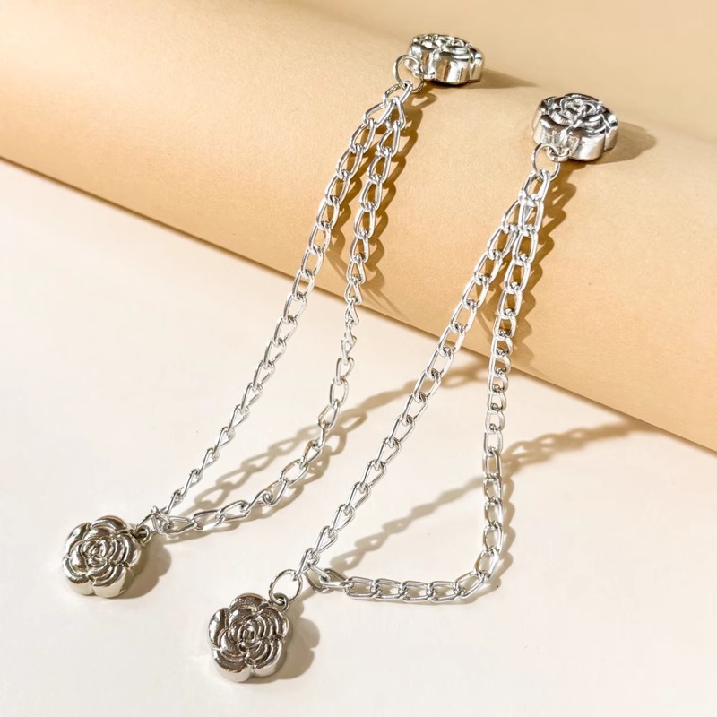 Esquina de la camiseta, peldaño apretado, artefacto corto, botones de nudos, mangas fijas, pantalones fijos, pies, cadena anti-flip, botones de succión magnéticos