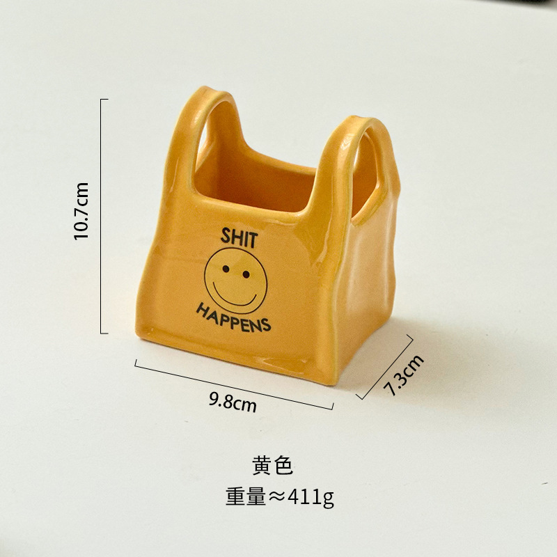 個性的な手は袋のデスクトップのアイデアの陶磁器の筆筒のリモコンの文房具の収納箱の化粧の筆の収納の桶の小さい置物をつまみます。|undefined