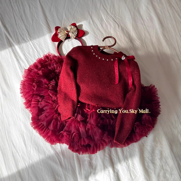 Demi-season children's red knitted sweater with bow with a round…