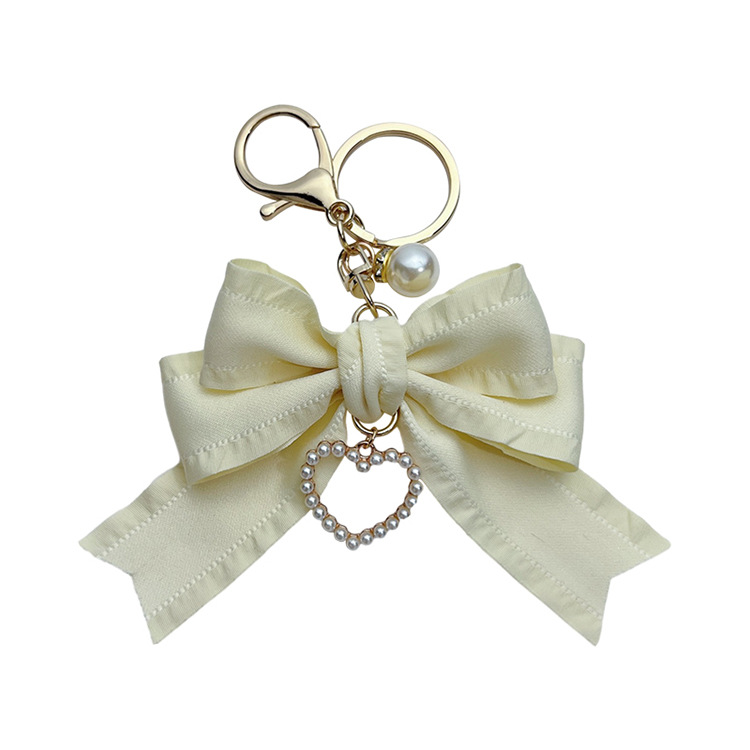 Estilo coreano arrugas cinta arco llavero colgante perla amor chica simple bolsa colgante teléfono móvil colgante