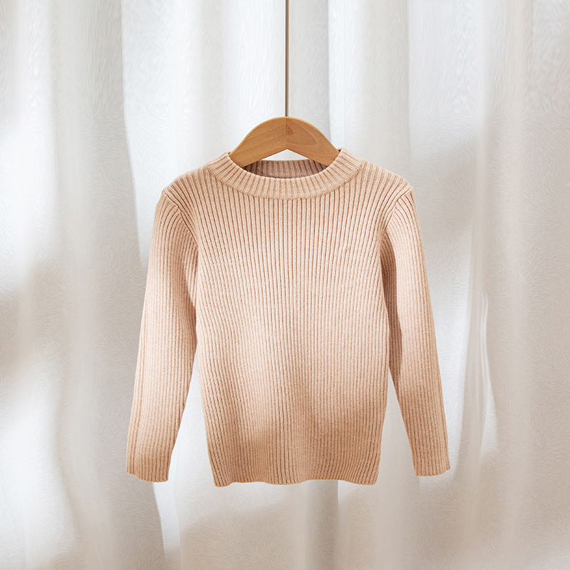 Suéteres infantiles 2025, nuevo estilo de otoño e invierno, ropa interior de punto para niños y niñas, suéter de cuello redondo versátil de color liso.