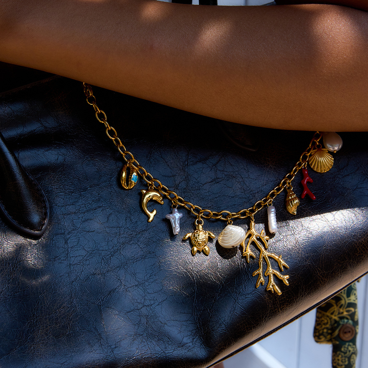 Wanxing estilo explosivo transfronterizo elemento marino bolsa colgante de acero inoxidable chapado en oro todo fósforo colgante de bolso femenino fábrica de colgantes al por mayor