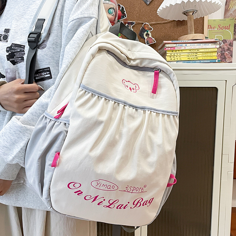 2024 nueva mochila de nailon para mujer, ocio, viaje al aire libre japonés, mochila escolar de gran capacidad para estudiantes de secundaria, mochila al por mayor