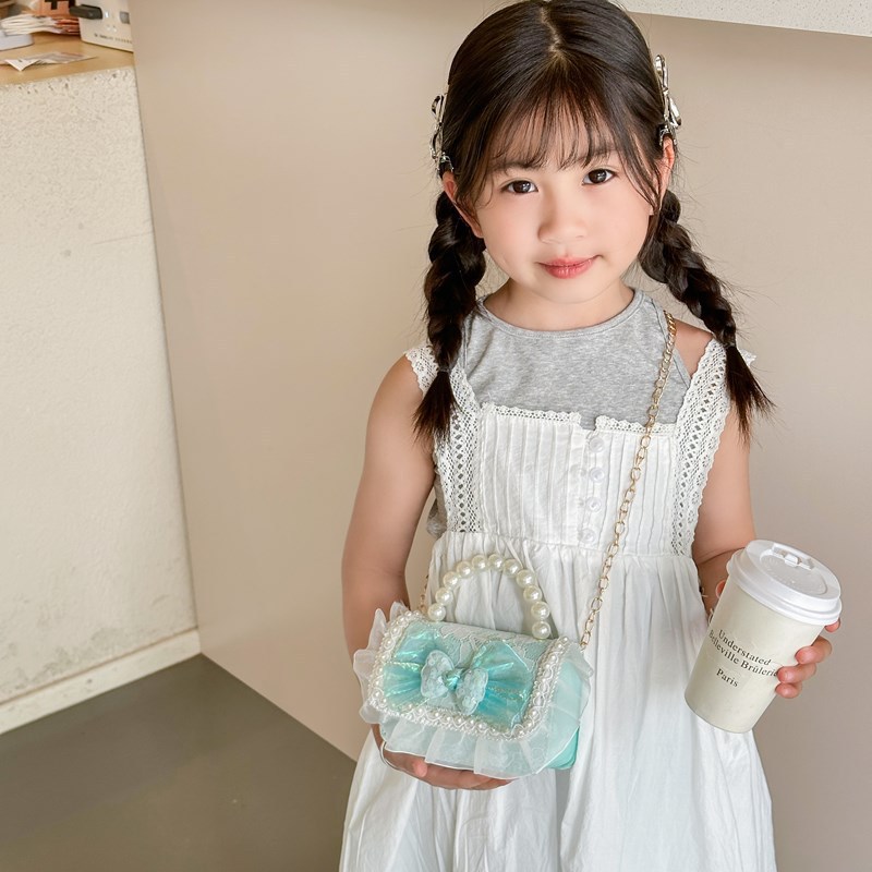 Bolso de perla de fragancia pequeña para niños Bolso de hombro de niña de dibujos animados de moda Bolso de monedero de bebé de todo fósforo con lazo