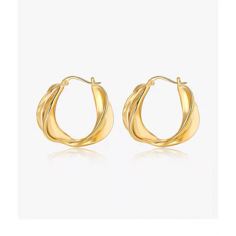 Golden metal small design earrings, trend of season