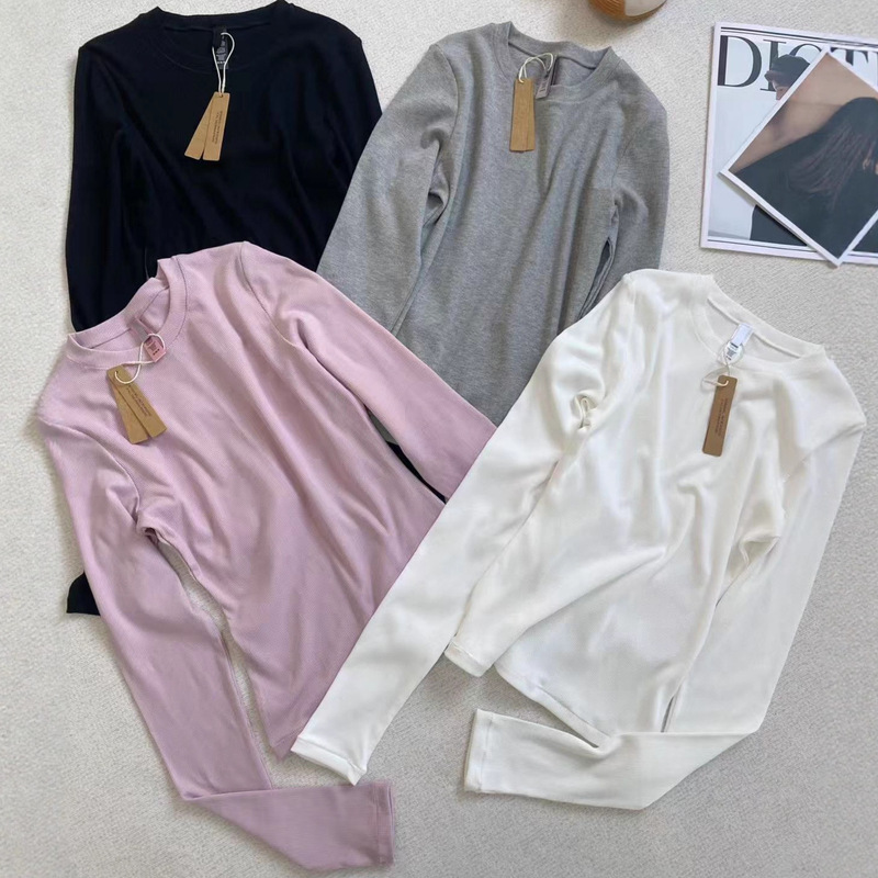 Skims Kardashian-Style Slim-Fit Long-Sleeve T-Shirt Base Layer with a Waist-Cinching Round Neck, Slimming Solid Color Top Skims Kardashian-Style Slim-Fit Long-Sleeve T-Shirt Base Layer with a Waist-Cinching Round Neck, Slimming Solid Color Top