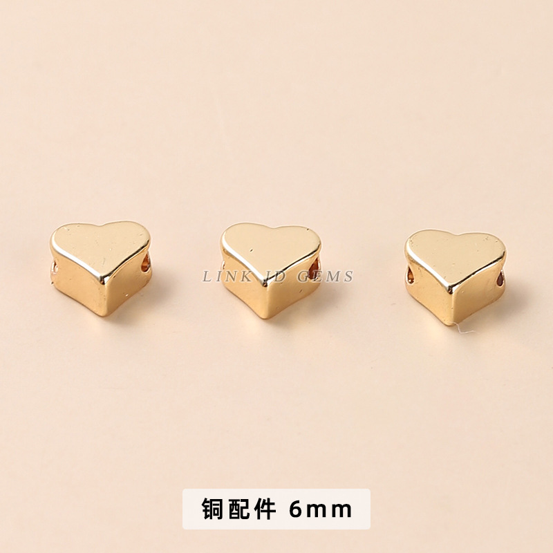 KC gold perforation love bronze bead