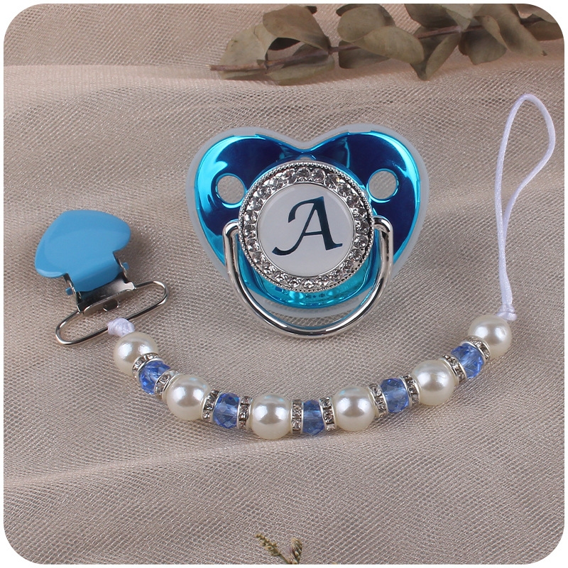 Nuevo bebé suministros melocotón corazón clip de hierro calmante bebé perla cristal chupete cadena anti-gota cadena chupete traje