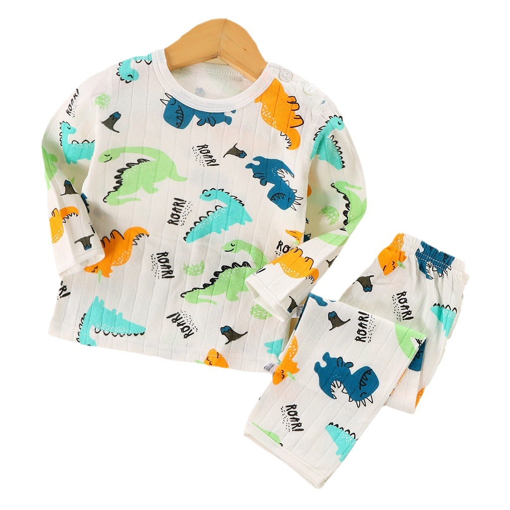 Ropa de casa estilo otoño-invierno para niños mayores, pijamas de algodón puro sin costuras, conjunto de camiseta de manga larga y pantalones, diseño sin costuras.