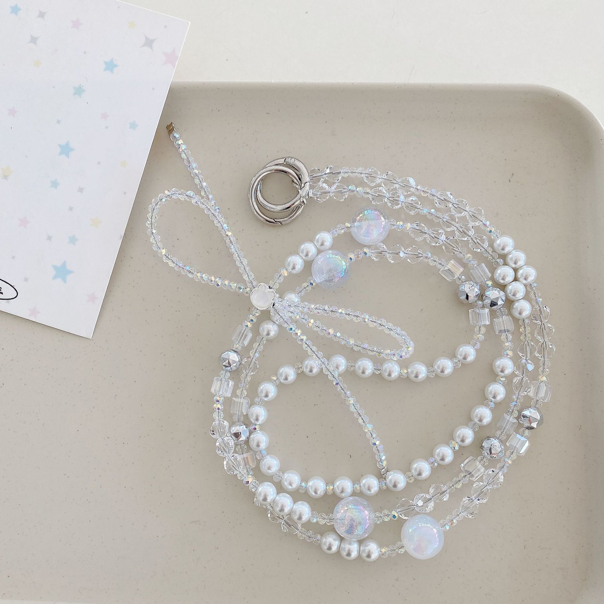 Boutique hecho a mano cadena colgante de alta gama arco fresco de cuatro colores cadena larga cordón de teléfono móvil de moda mensajero largo/colgante